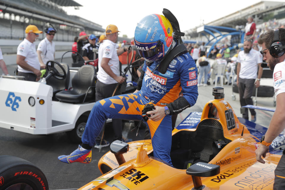 Fernando Alonso, of Spain, climbs out his car at the conclusion of qualifications for the Indianapolis 500 IndyCar auto race at Indianapolis Motor Speedway, Saturday, May 18, 2019, in Indianapolis. (AP Photo/Michael Conroy)