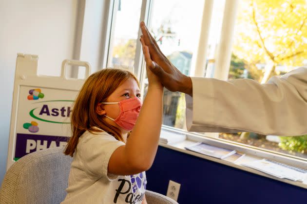 Hannah Beltram, 6, high-fives Dr. Eugenio Fernandez after she received the Pfizer COVID-19 vaccine for children in Providence, Rhode Island, on Nov. 5, 2021. (Photo: via Associated Press)