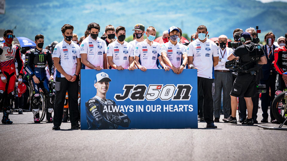 Fellow riders, pictured here holding a minute of silence on the starting grid in memory of Moto3 rider Jason Dupasquier.