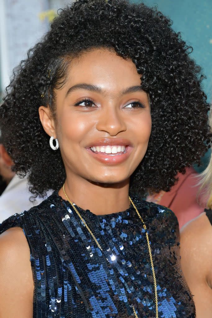 <p>Creating a deep side parting and holding the hair in place with a braid looks just fabulous with a sequin gown, as Yara Shahidi, as it does with jeans and a tee.</p>