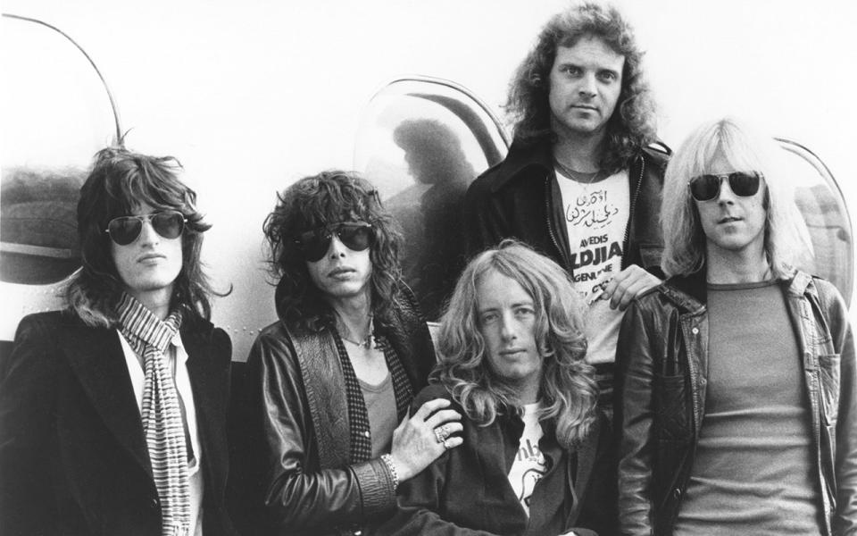 Black and white portrait of Aerosmith in the 1970s