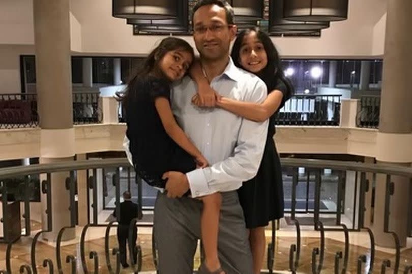 Professor Amit Patel, who died on 28 October 2021, eight weeks after he underwent a lung procedure at Wythenshawe Hospital in south Manchester, pictured with his two daughters -Credit:MEN Media