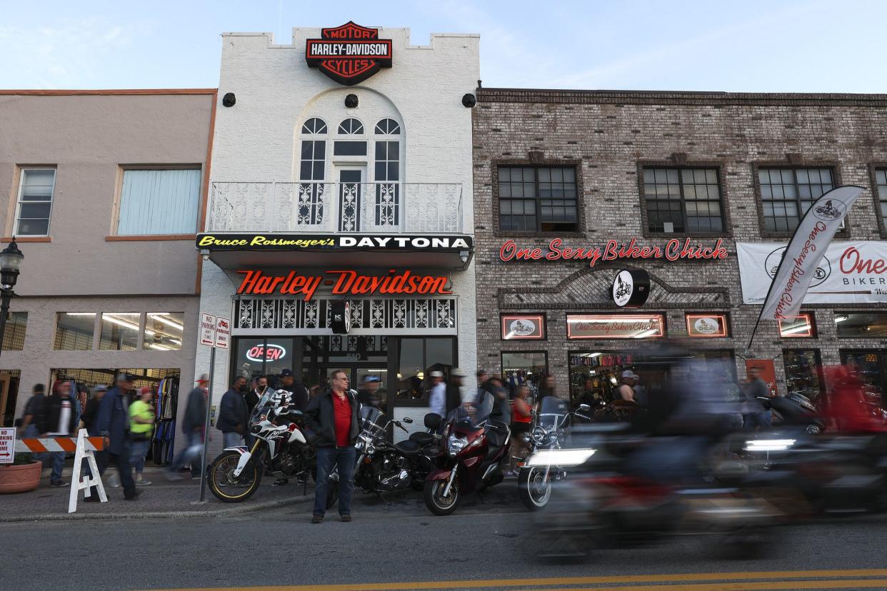 Bikers gather outside of a Harley-Davidson shop on Main Street in Daytona, FL during Bike Week on March 5, 2021. (Sam Thomas/Orlando Sentinel)