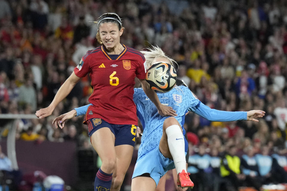 Spain's Aitana Bonmati, left, challenges for the ball with England's Alex Greenwood during the Women's World Cup soccer final between Spain and England at Stadium Australia in Sydney, Australia, Sunday, Aug. 20, 2023. (AP Photo/Alessandra Tarantino)