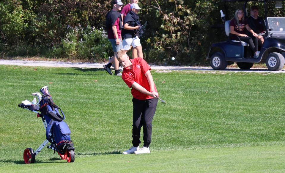 Crestview's Cole Bowman chips onto the green of No. 3 at Stone Ridge in the Division III district tournament.