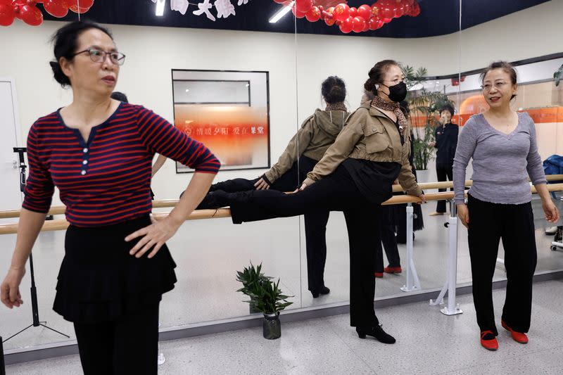 Elderly people practice dance at Mama Sunset, a learning centre for middle-aged and senior people in Beijing