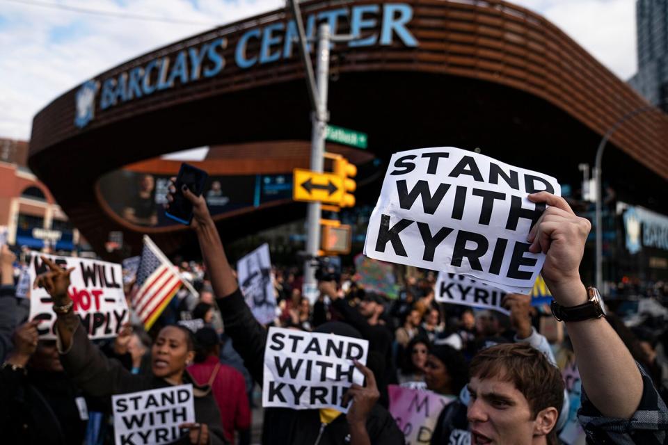 Protesters rallying against COVID-19 vaccination mandates and in support of Kyrie Irving gather in the street outside the Barclays Center before an NBA basketball game between the Brooklyn Nets and the Charlotte Hornets, in New York Virus Outbreak NYC Vaccine Mandate, New York, United States - 24 Oct 2021