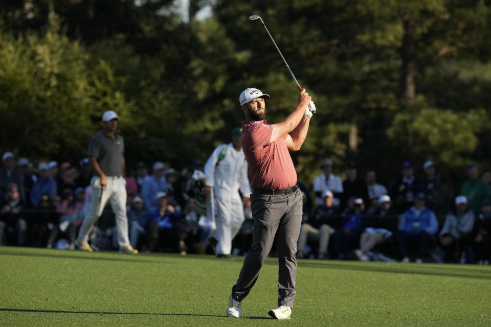 Jon Rahm, of Spain, hits from the fairway on the 15th hole during the final round of the Masters golf tournament at Augusta National Golf Club on Sunday, April 9, 2023, in Augusta, Ga. (AP Photo/Mark Baker)