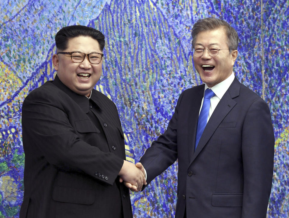 FILE - In this April 27, 2018, file photo, North Korean leader Kim Jong Un, left, poses with South Korean President Moon Jae-in for a photo inside the Peace House at the border village of Panmunjom in Demilitarized Zone, South Korea. South Korea declared a crackdown against supposed “fake news” flourishing online, vowing to use its criminal laws to curb what officials here have proclaimed a threat to democracy. Some experts say Moon’s government is becoming increasingly sensitive about public opinion as it desperately tries to keep optimism alive for its fragile diplomacy with North Korea. (Korea Summit Press Pool via AP. Pool, File)