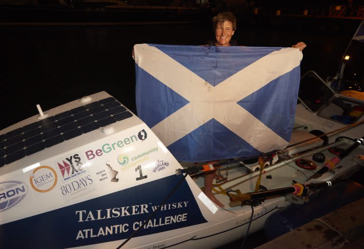 A mother-of-two has rowed her way into the record books, becoming the fastest woman to cross the Atlantic in the history of a gruelling race.
