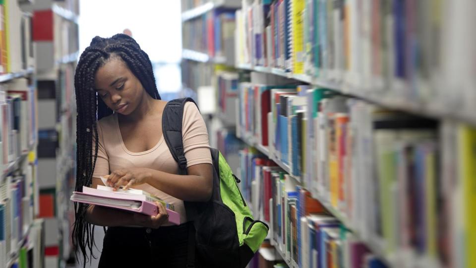 female student in library