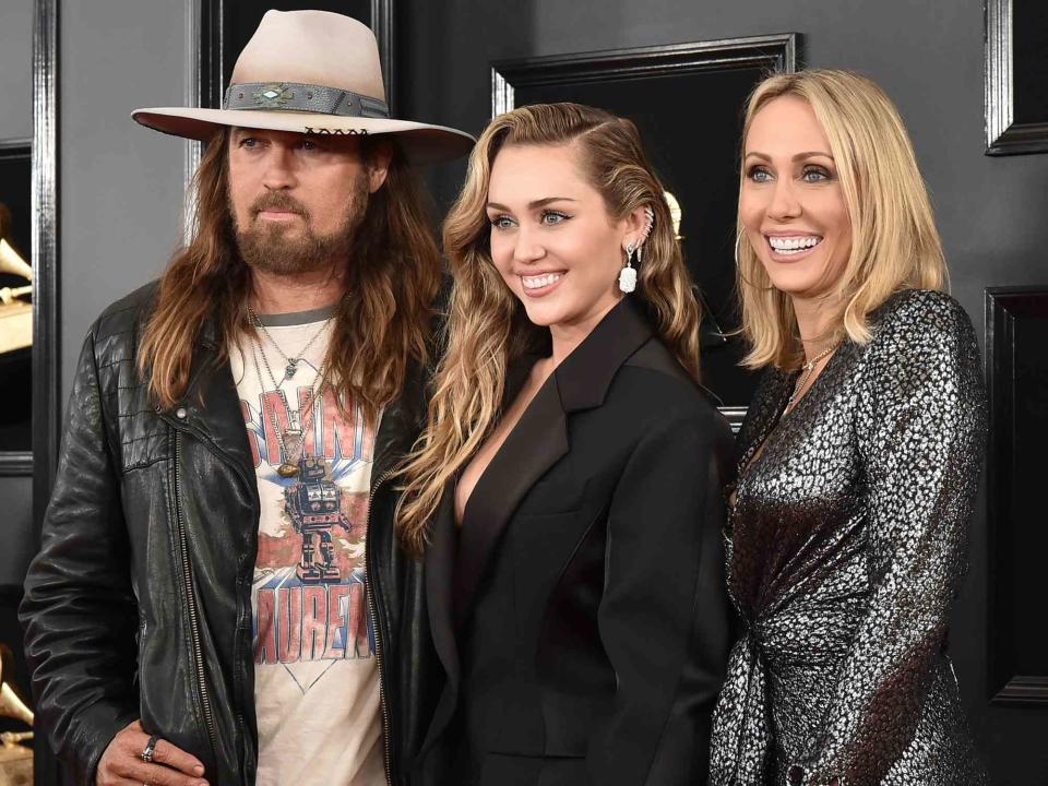 <p>David Crotty/Patrick McMullan/Getty</p> Billy Ray Cyrus, Miley Cyrus and Tish Cyrus attend the 61st Annual Grammy Awards