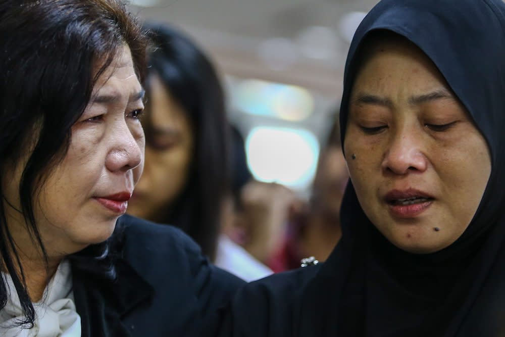 Susanna Koh and Norhayati Mohd Arifin attend the announcement of Suhakam’s public inquiry findings into the disappearances of their husbands, pastor Raymond Koh and Amri Che Mat, in Kuala Lumpur April 3, 2019. — Picture by Hari Anggara