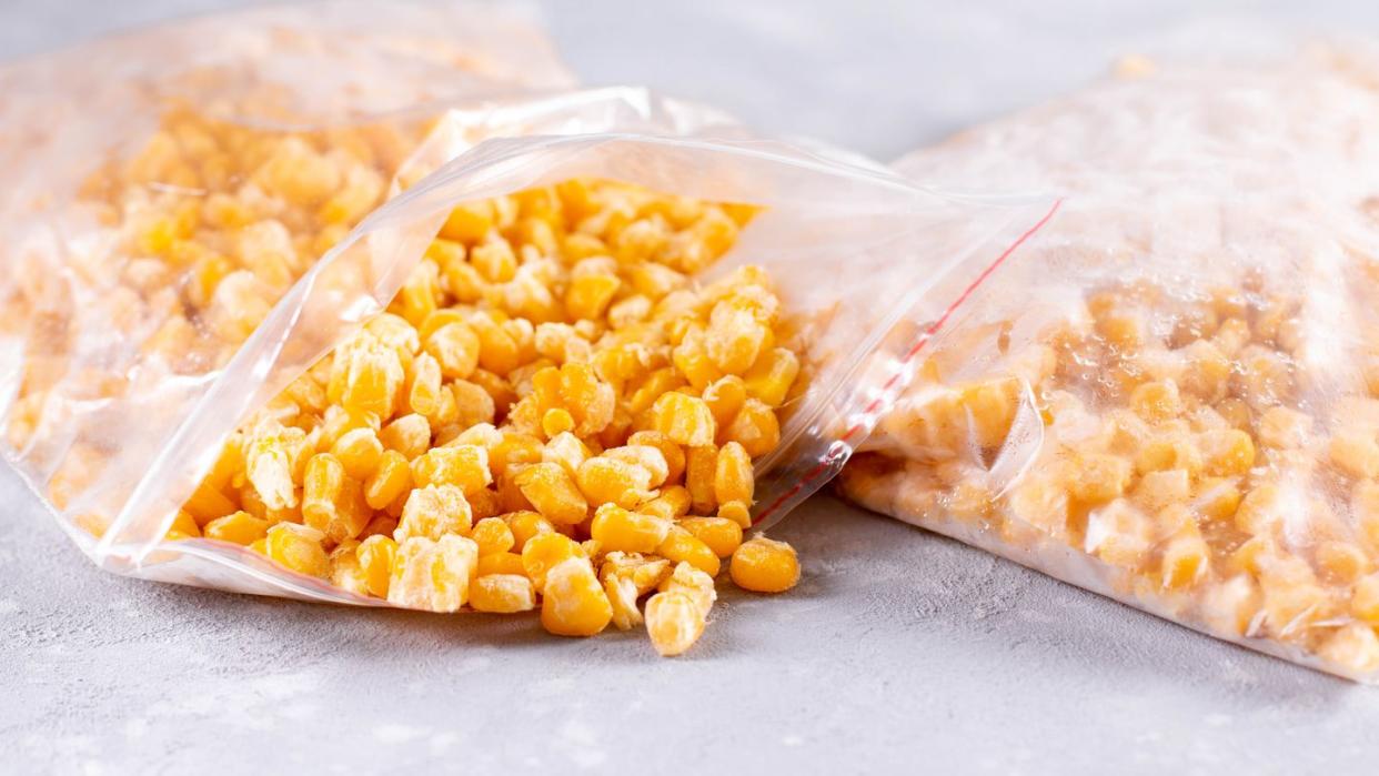 open bag of uncooked frozen corn