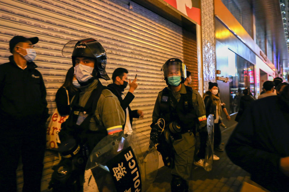 MONG KOK, HONG KONG, CHINA - 2020/01/26: Police during a dispersal mission of Hong Kong protestors wear face masks in addition to their protective gear following reports of the Wuhan Coronavirus appearing in Hong Kong. The Wuhan Coronavirus is a new and highly infectious SARS-strain virus that originated in the Hubei province of China, and has been traced back to an animal market in the city of Wuhan. (Photo by Katherine Cheng/SOPA Images/LightRocket via Getty Images)