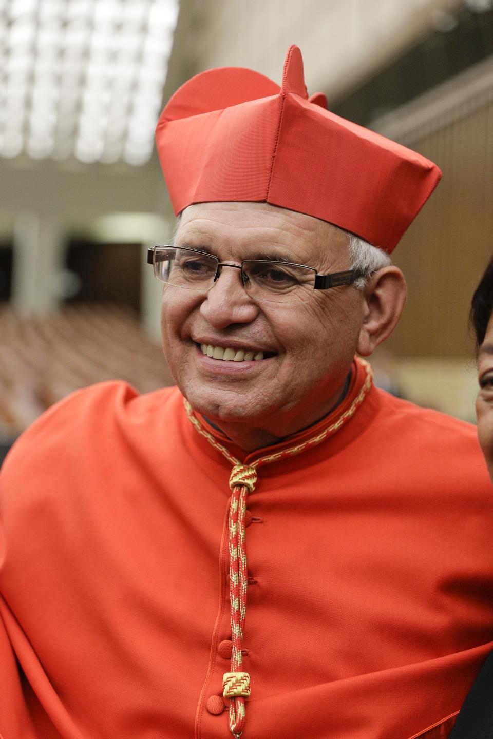 Cardinal Alvaro Leonel Ramazzini Imeri poses for photographers prior to meeting relatives and friends after he was elevated to cardinal by Pope Francis, at the Vatican, Saturday, Oct. 5, 2019. Pope Francis has chosen 13 men he admires and whose sympathies align with his to become the Catholic Church's newest cardinals. (AP Photo/Andrew Medichini)