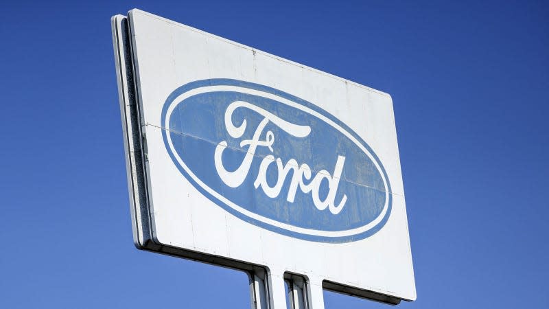 A photo of a Ford sign at a factory. 