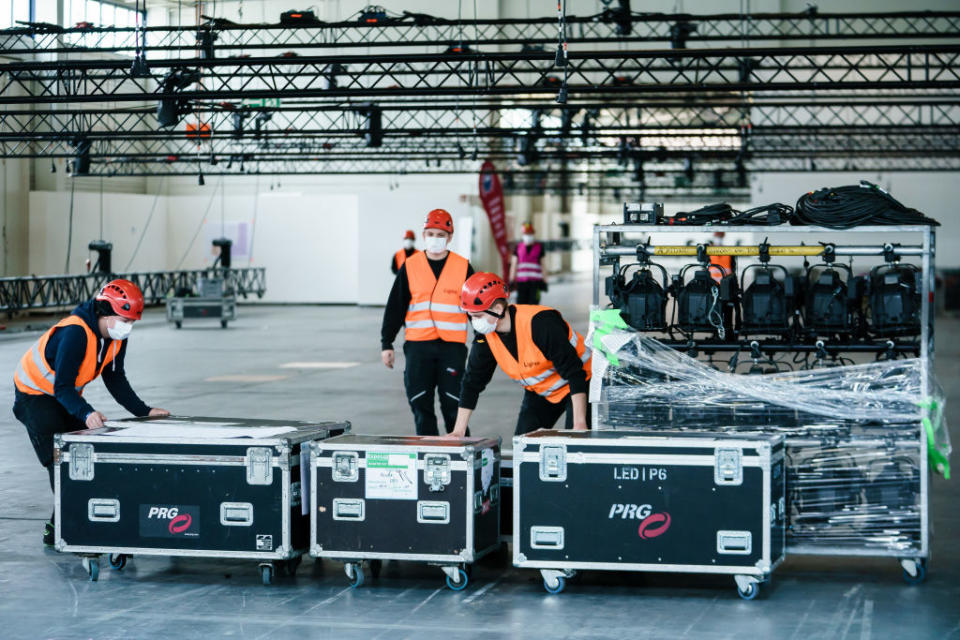 Workers convert Messe Berlin trade fair hall into a hospital for treating Covid-19 patients. Source: Getty