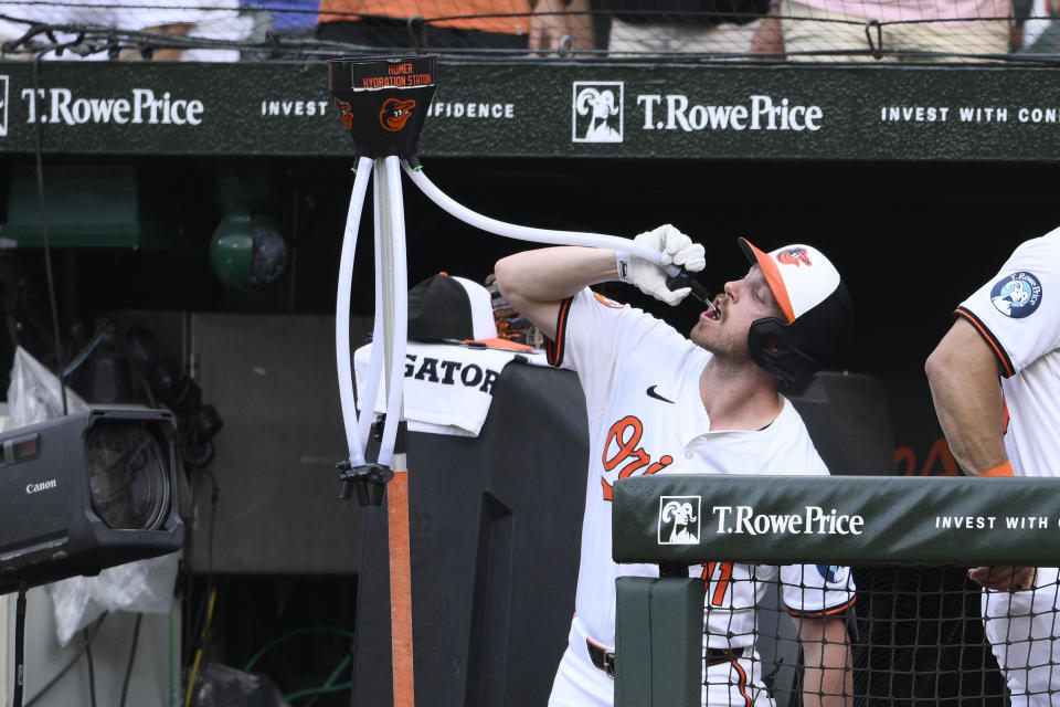 Baltimore Orioles' Jordan Westburg drinks form the "homer hydration station" as he celebrates his home run during the second inning of a baseball game against the Chicago Cubs, Tuesday, July 9, 2024, in Baltimore. (AP Photo/Nick Wass)