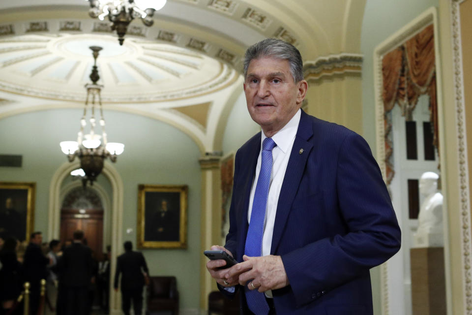 FILE - In this Wednesday Jan 29, 2020 file photo, Sen. Joe Manchin, D-W.Va., walks to the Senate chamber after a break in the impeachment trial of President Donald Trump at the U.S. Capitol in Washington. The U.S. Postal Service is considering closing post offices across the country, sparking worries ahead the anticipated surge of mail-in ballots in the 2020 elections, U.S. Sen Joe Manchin and a union leader said Wednesday, July 29, 2020. (AP Photo/Steve Helber, File)