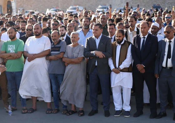 Prime Minister of Libya under the Government of National Unity Abdul Hamid al-Dbeibeh, fourth from right, is seen during a funeral prayer in memory of those who lost their lives due to the flood disaster in the country in Tripoli on Sept. 12.<span class="copyright">Libyan Government of National Unity/Anadolu Agency/Getty Images</span>