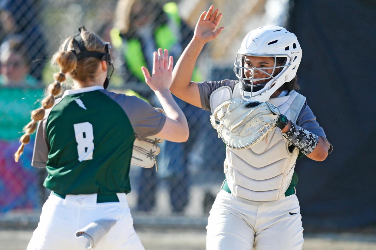 Estrella Rivas (right) celebrates with teammate Izzy Sousa (left) after the final out was recorded on Cranston East's 6-0 win over Tiverton Friday. The Thunderbolts are off to a 7-0 start this spring, matching their win total from last season.