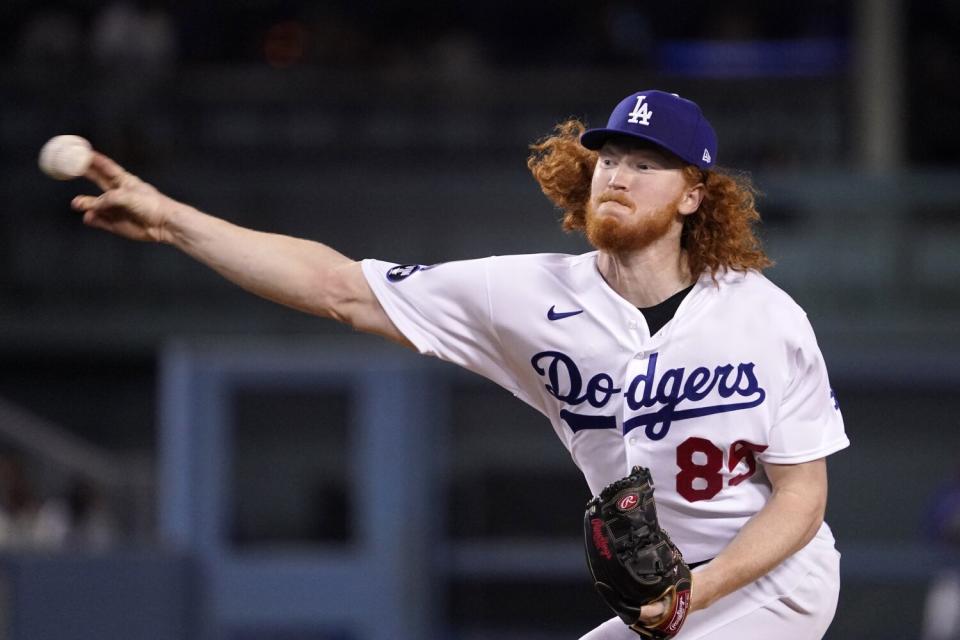 Dodgers pitcher Dustin May throws to the plate.