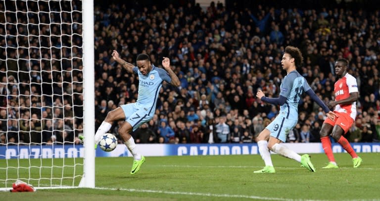 Manchester City's midfielder Raheem Sterling (L) jumps out of the way as Manchester City's midfielder Leroy Sane (2R) taps in their fifth goal during the Champions League football match against Monaco February 21, 2017