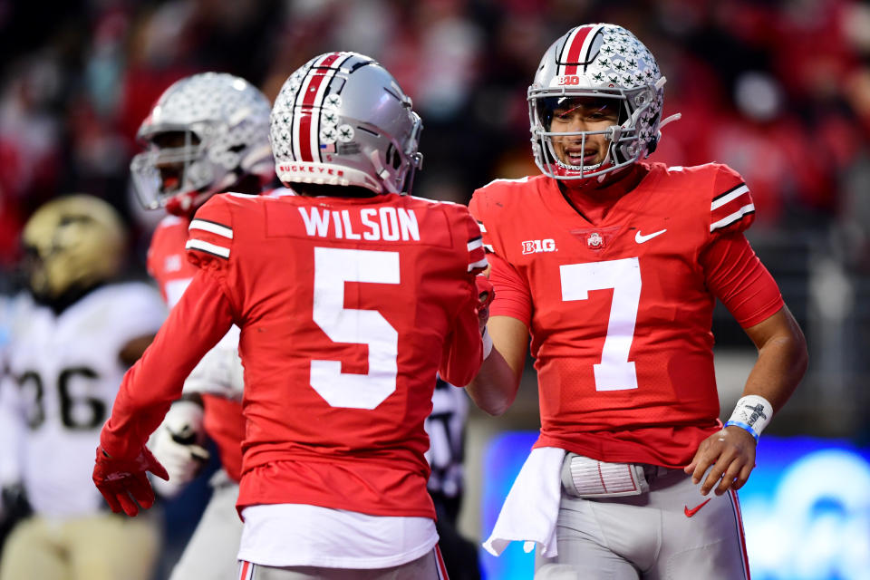 Ohio State's Garrett Wilson (left) celebrates with C.J. Stroud after a touchdown during the first half of a game against Purdue on Nov. 13. (Emilee Chinn/Getty Images)