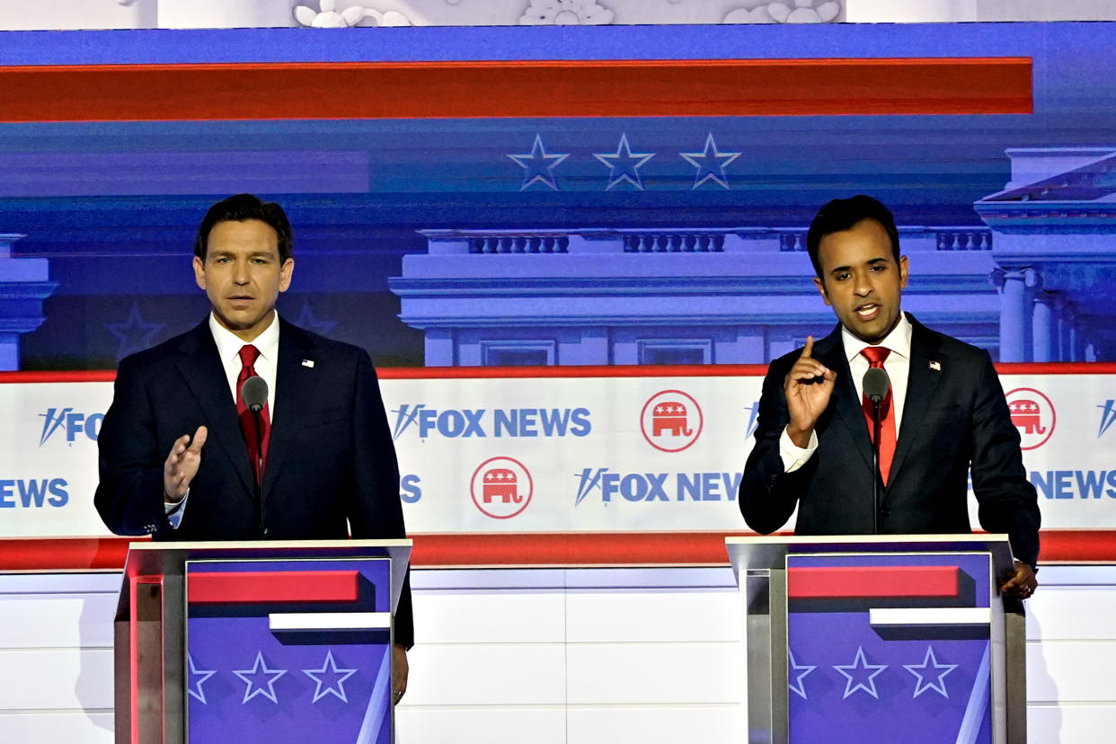 Biotech entrepreneur Vivek Ramaswamy and Florida Gov. Ron DeSantis sparring at the debate