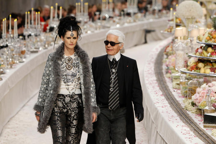 Karl Lagerfeld, Stella Tennant German fashion designer Karl Lagerfeld with at his side British model Stella Tennant, left, acknowledges applause at the end of the presentation of his Paris-Bombay collection for Chanel, presented at the Grand Palais in ParisFrance Fashion Chanel, Paris, France
