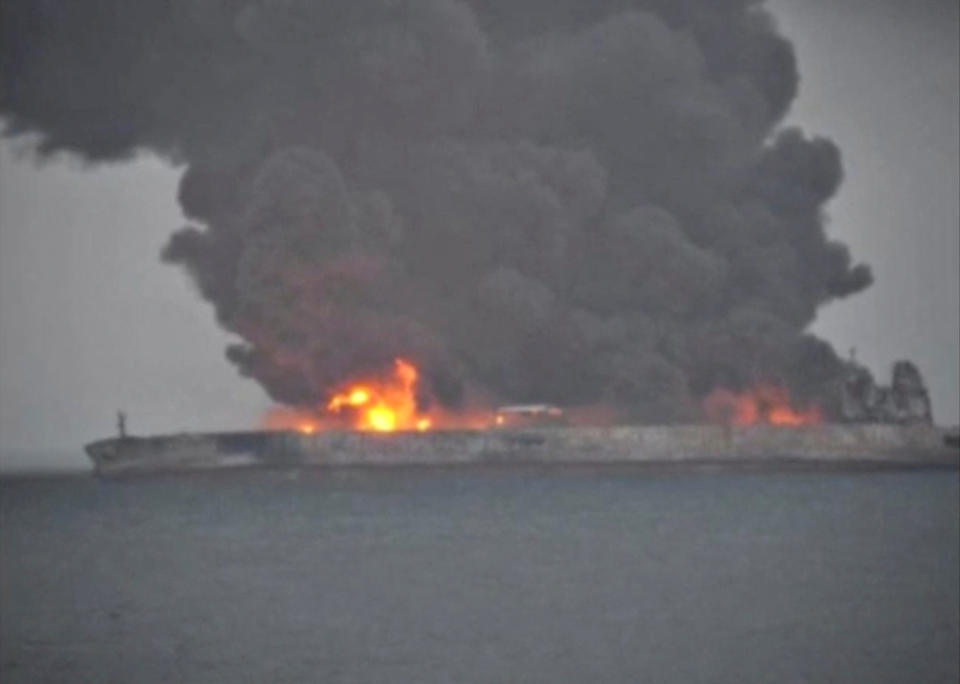 <p>Smoke and fire is seen from Panama-registered tanker Sanchi carrying Iranian oil after it collided with a Chinese freight ship in the East China Sea, in this still image taken from a Jan. 7, 2018 video.(Photo: China Daily via Reuters) </p>