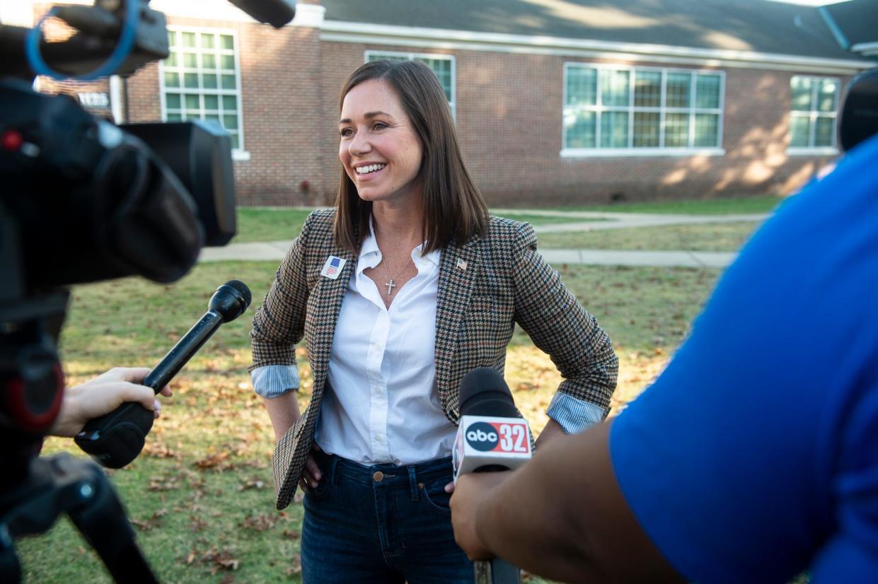 U.S. Senate candidate Katie Britt talks to the media after voting at Huntingdon College in Montgomery, Ala., on Tuesday, Nov. 8, 2022.