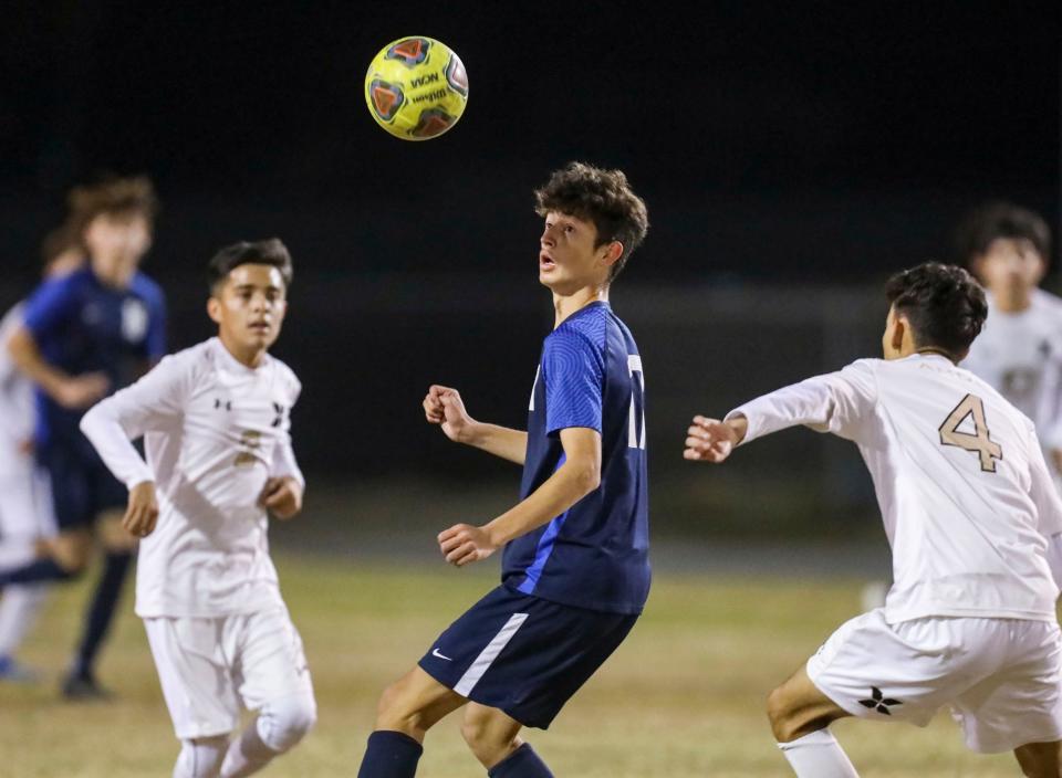 La Quinta's Aidan Brothers (17) keeps his eyes on the ball during the first half of their game at La Quinta High School, Tuesday, Jan. 4, 2022, in La Quinta, Calif. 