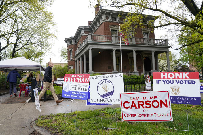 A voter leaves the Benjamin Harrison Presidential Site in Indianapolis, Tuesday, May 3, 2022, after voting in the Indiana primary election. The site was the former home of Harrison, the 23rd President of the United States from 1889 to 1893. (AP Photo/Michael Conroy)