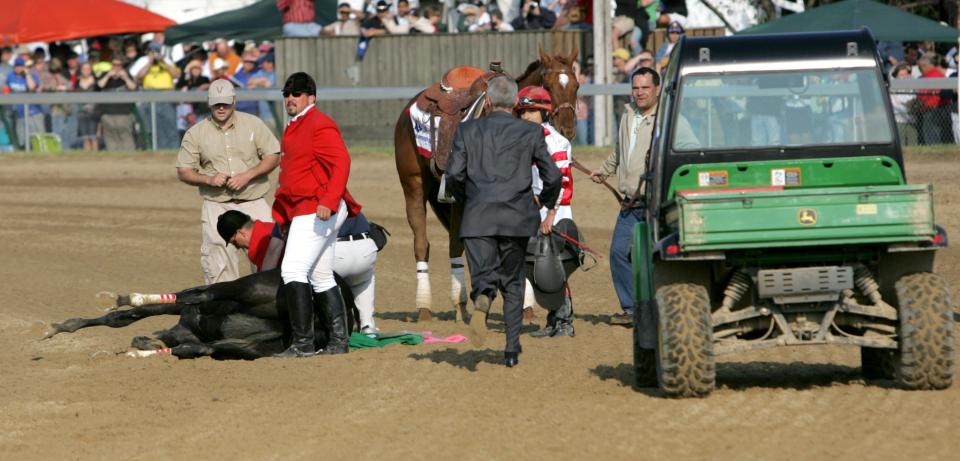 Track personnel attend to Eight Belles after she broke down after the finish of the 134th running of the Kentucky Derby at Churchill Downs, in Louisville, Kentucky, Saturday, May 3, 2008. (Getty Images)