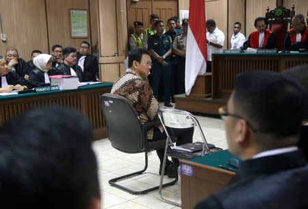 Jakarta Governor Basuki Tjahaja Purnama, popularly known as "Ahok", sits on the defendant's chair at the start of his trial hearing at North Jakarta District Court in Jakarta, Indonesia, Tuesday, Dec. 13, 2016. REUTERS/Tatan Syuflana/Pool