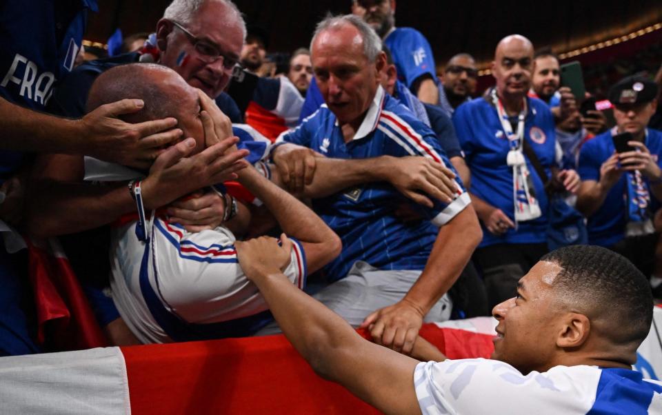 Mbappe strikes a fan - KIRILL KUDRYAVTSEV/AFP via Getty Images