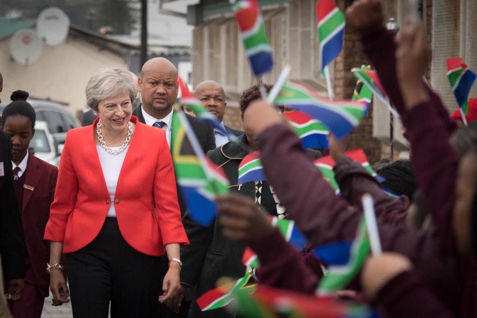 Theresa May meets students and staff at I.D. Mkize Secondary School in Cape Town (PA Images)