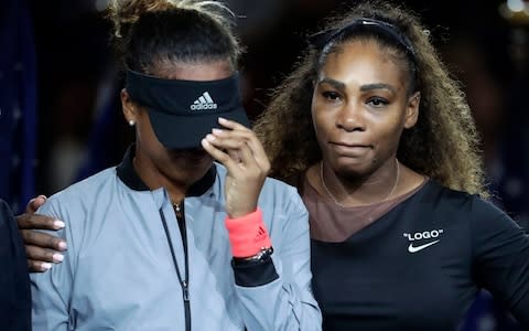 Naomi Osaka, left, of Japan, is hugged by Serena Williams - Credit: AP