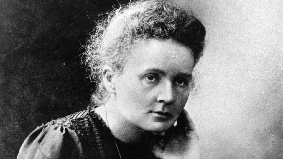 marie curie sitting with her head resting on her left hand in a photograph