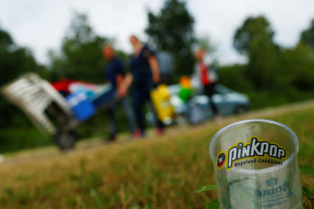 An empty beer glass is seen on the floor as visitors leave the festival grounds near a scene where a van struck into people after a concert at the Pinkpop festival in Landgraaf, the Netherlands June 18, 2018. REUTERS/Thilo Schmuelgen