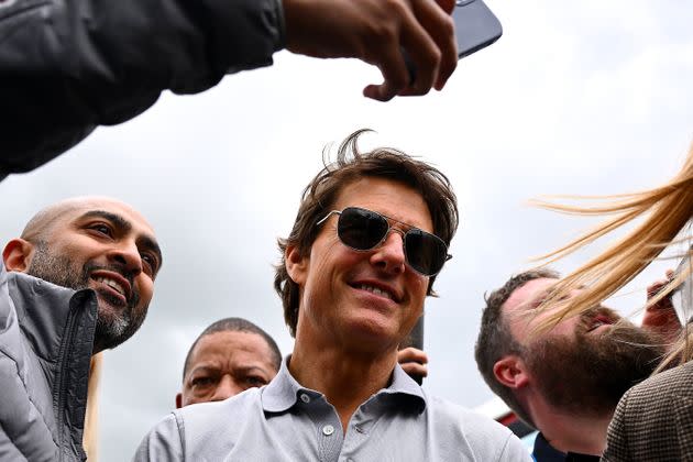 Cruise was mobbed by excited fans at a London restaurant Friday and graciously posed for pictures. (Photo: Clive Mason via Getty Images)