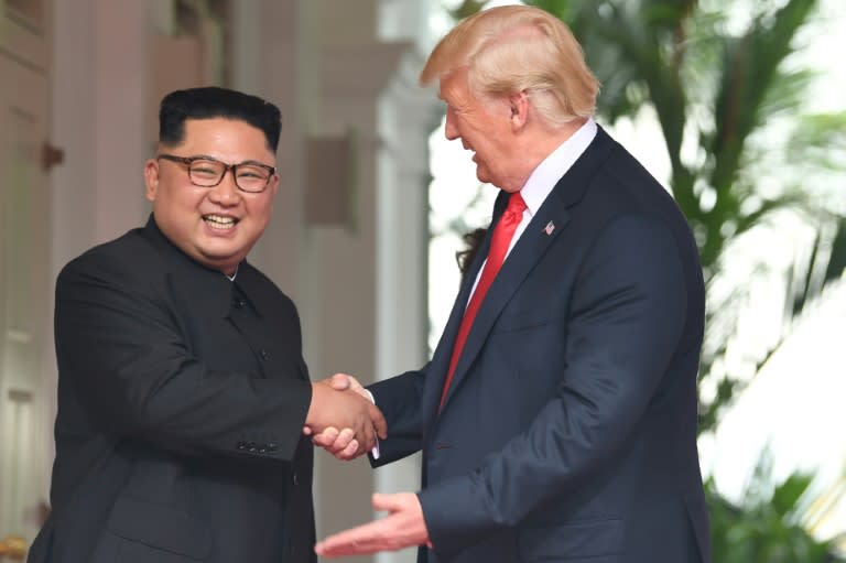 North Korean leader Kim Jong Un and President Donald Trump at the start of their historic summit last month