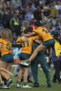 Australian celebrate beating New Zealand in the Women's Final at the Rugby World Cup 7's Championship held in Cape Town, South Africa, Sunday, Sept.11, 2022. (AP Photo/Halden Krog)