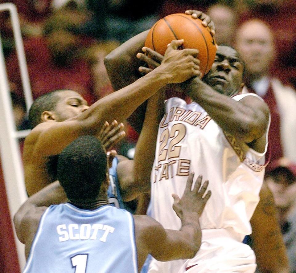 North Carolina’s Rashad McCants and Melvin Scott put pressure on Florida State’s Tim Pickett during their game in January 2004. News & Observer file photo