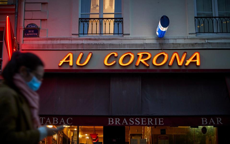 A Parisian walks past the Au Corona Brasserie in France -  Kiran Ridley / Getty