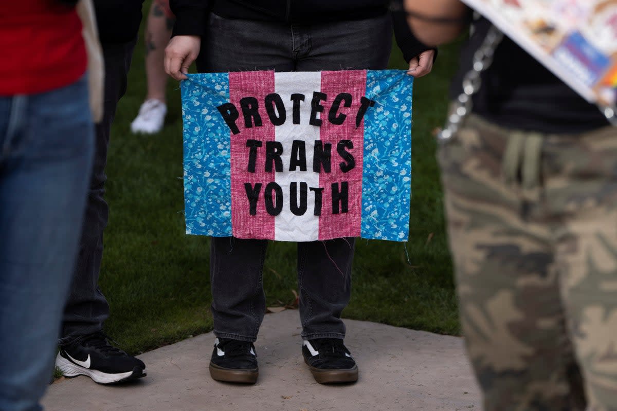 Demonstrators march outside the Arizona State Capitol in Phoenix on 22 January.  (REUTERS)