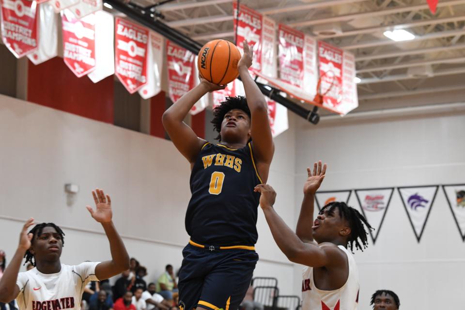 Winter Haven's Jamie Phillips goes up strong in a contest versus Edgewater in Class 6A regional quarterfinal. Phillips scored 20 in the contest, and the Blue Devils won 68-60 to advance.