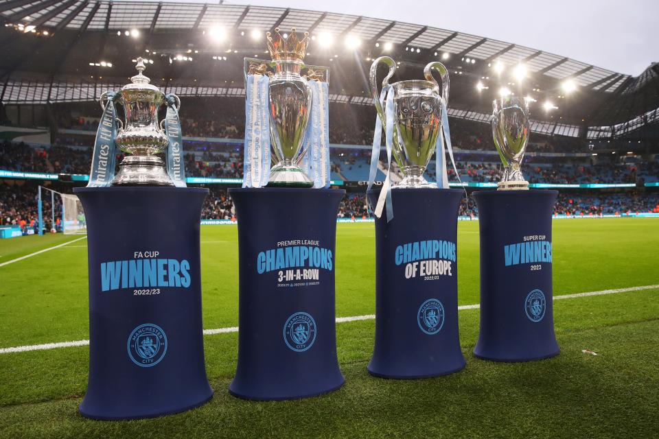 MANCHESTER, ENGLAND - NOVEMBER 04: The Emirates FA Cup, English Premier League, UEFA Champions League and UEFA Super Cup trophies are displayed at half-time during the Premier League match between Manchester City and AFC Bournemouth at Etihad Stadium on November 04, 2023 in Manchester, England. (Photo by Catherine Ivill/Getty Images)